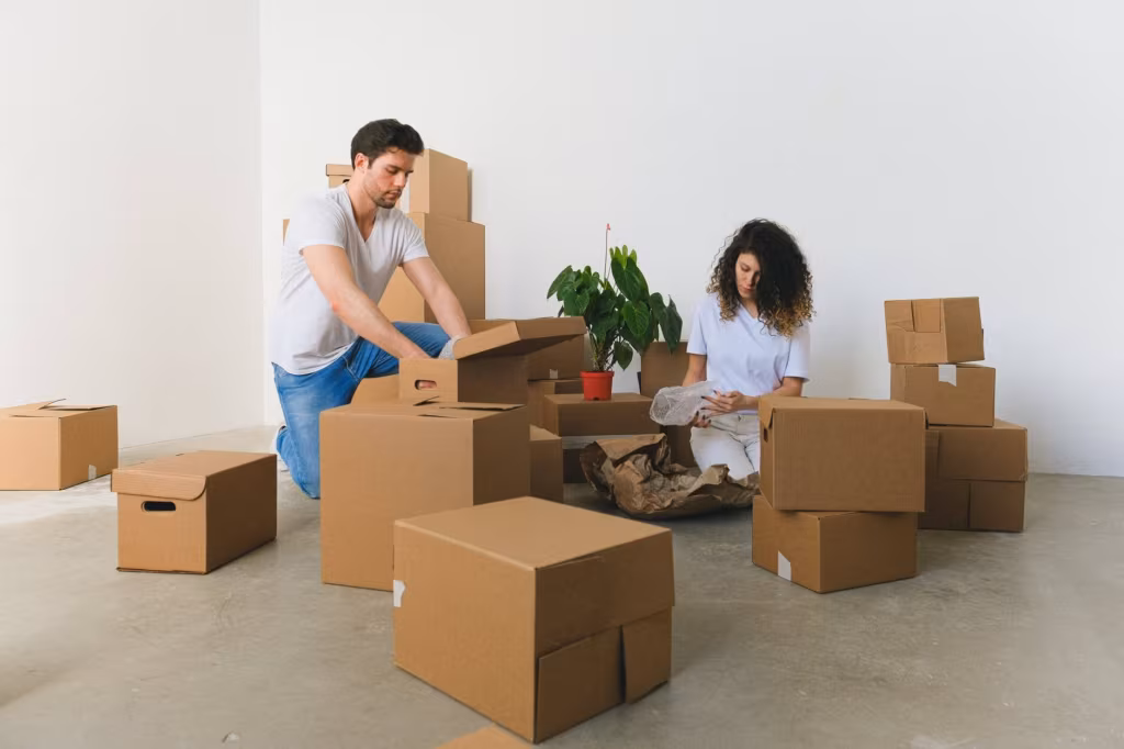 Couple packing for moving across the country