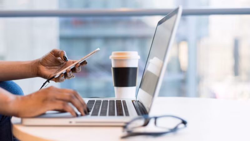 Woman looking online for packing supplies for cross-country moving