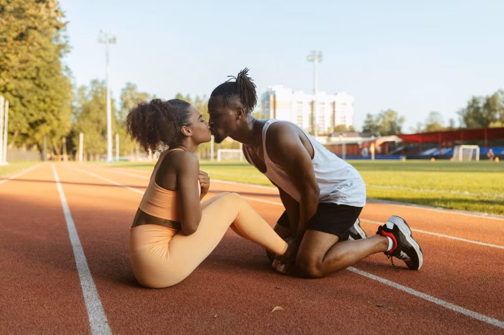 a handsome couple training together and kissing