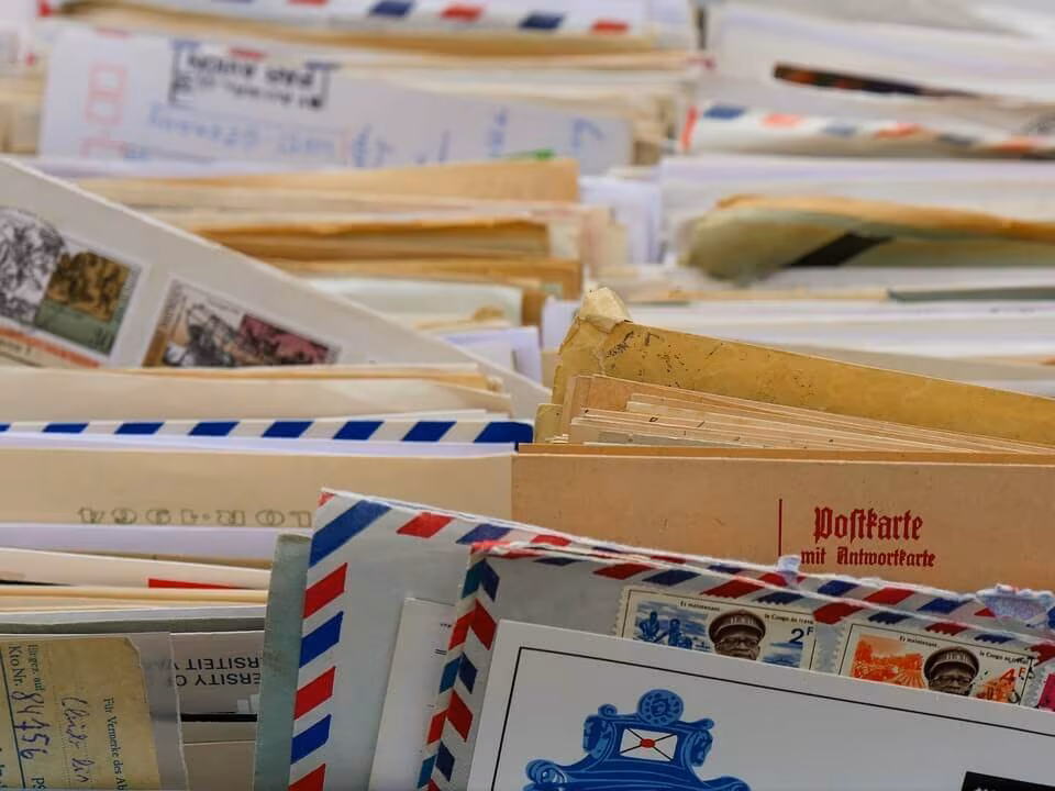 A pile of old letters and postcards