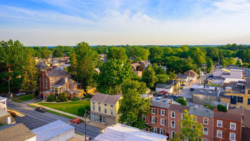 An aerial view of a leafy small town
