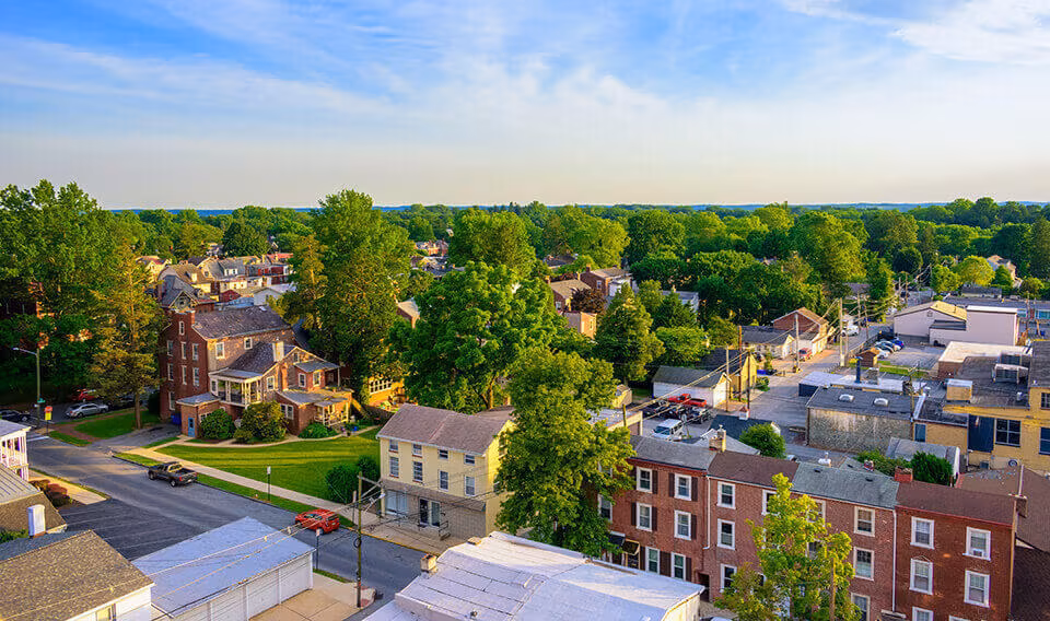 An aerial view of a leafy small town