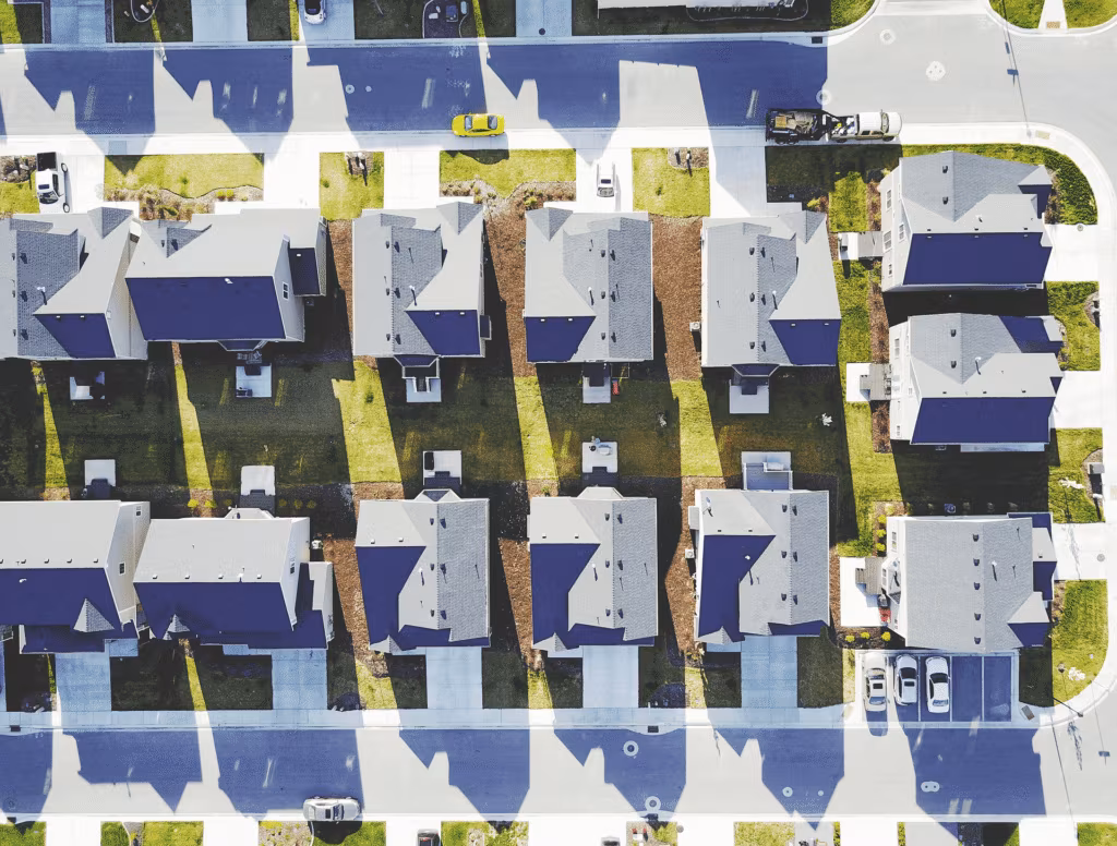 An aerial view of rows of suburban houses