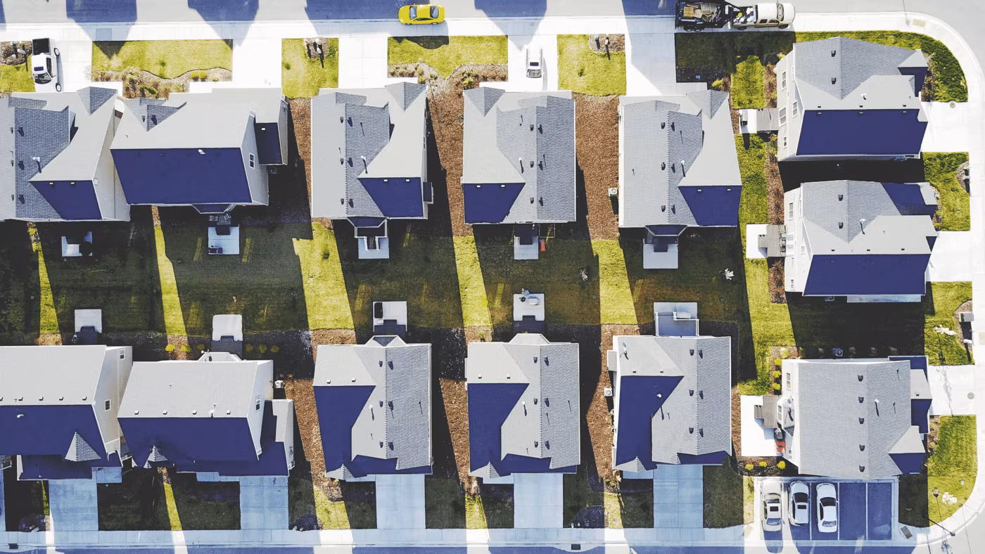 An aerial view of rows of suburban houses
