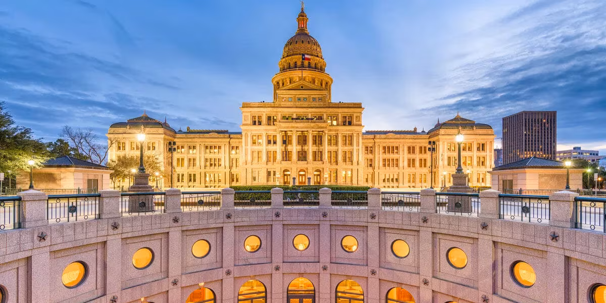 The Texas State Capitol building illuminated at dusk