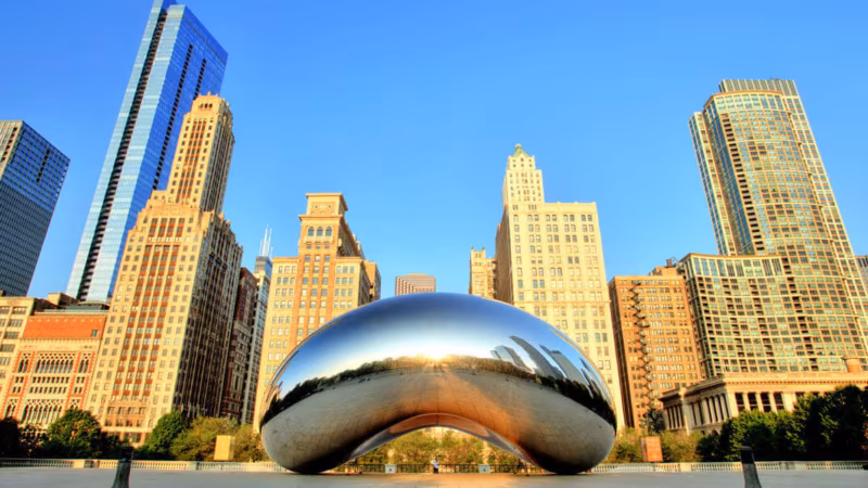 The Chicago skyline with the mirrored Cloud Gate sculpture in the foreground