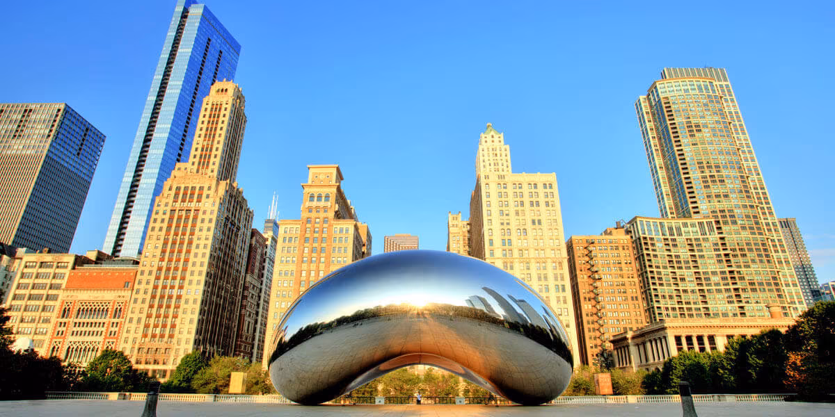 The Chicago skyline with the mirrored Cloud Gate sculpture in the foreground
