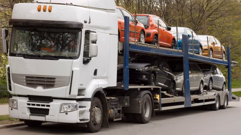 An open trailer moving across country
