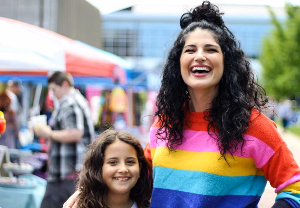 a woman and a girl smiling happily after moving across country