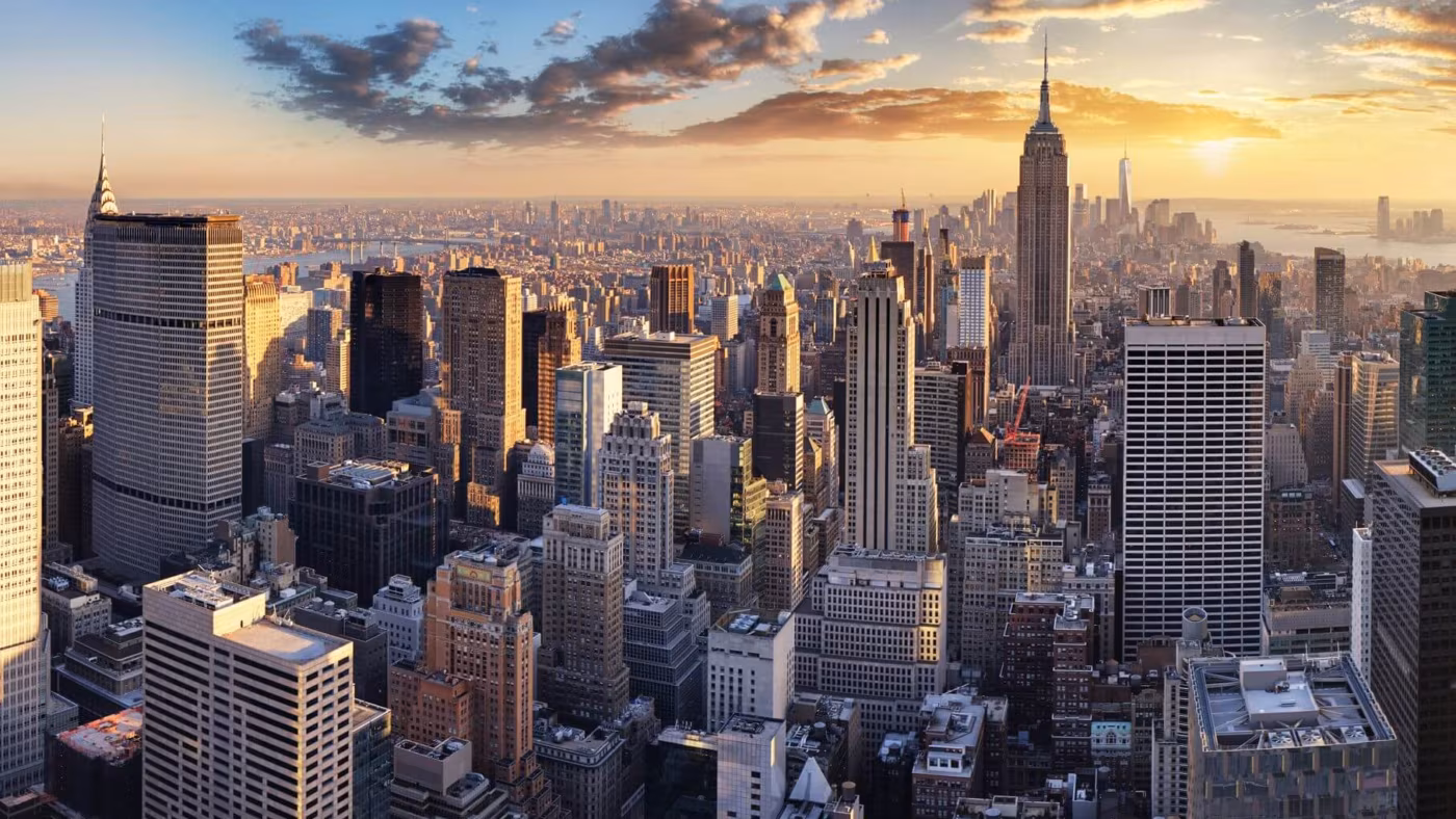 An aerial view of the Manhattan skyline at sunset