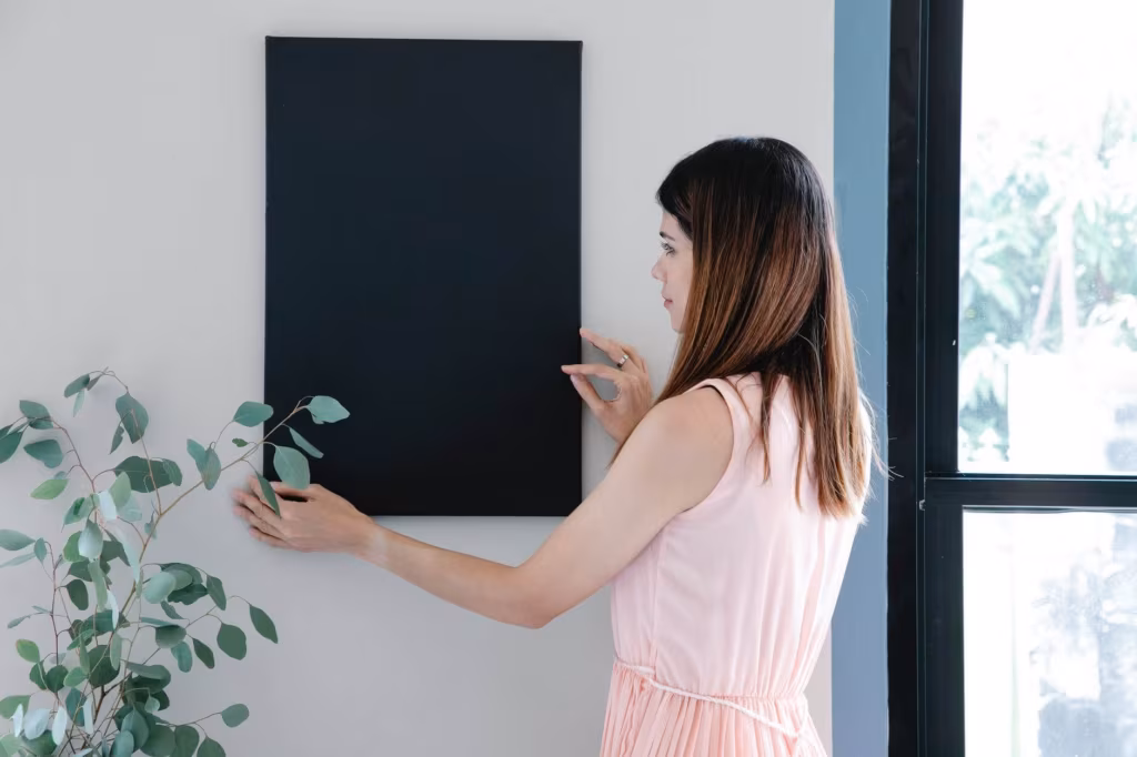A woman hanging a decoration