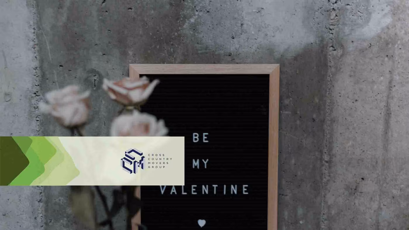 Roses and a board with "be my Valentine" written on it