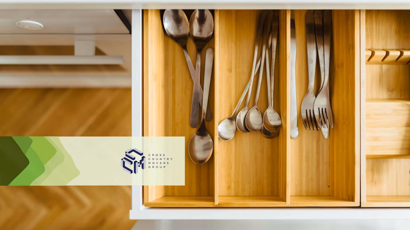 Cutlery in an open drawer Cross Country Moving Group Logo