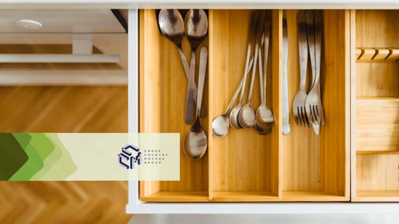 Cutlery in an open drawer Cross Country Moving Group Logo