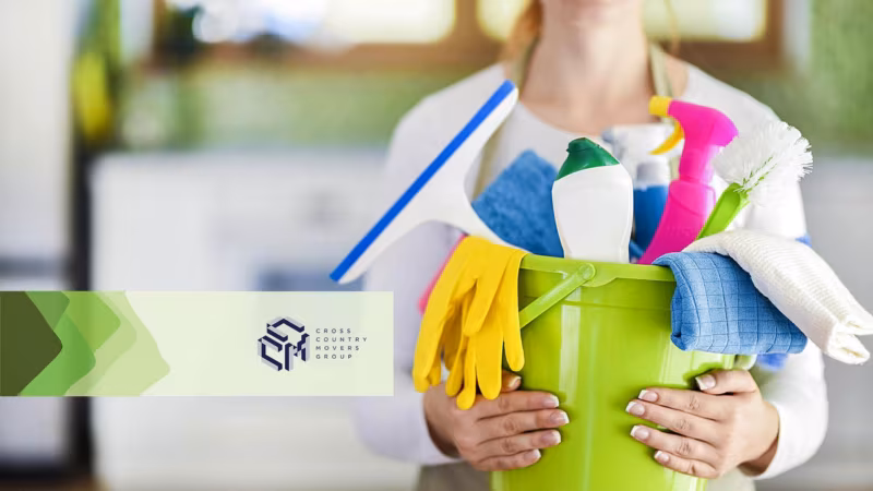 A woman holding a bucket with tools and products Cross Country Movers Group logo
