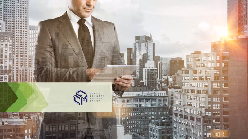 A man in a suit holding a phone in front of a city skyline