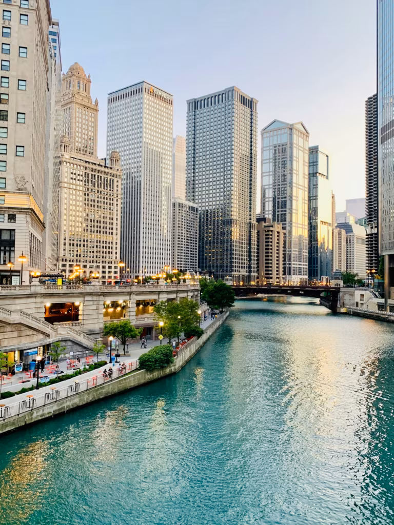 A beautiful daytime view of modern high-rise buildings and architecture along the Chicago Riverwalk in Illinois.