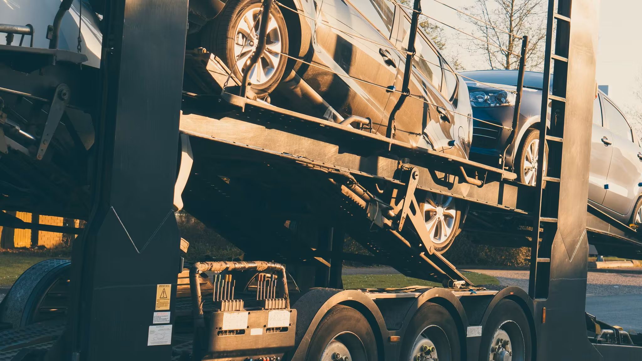 The wheels and underside of an articulated trailer, close in