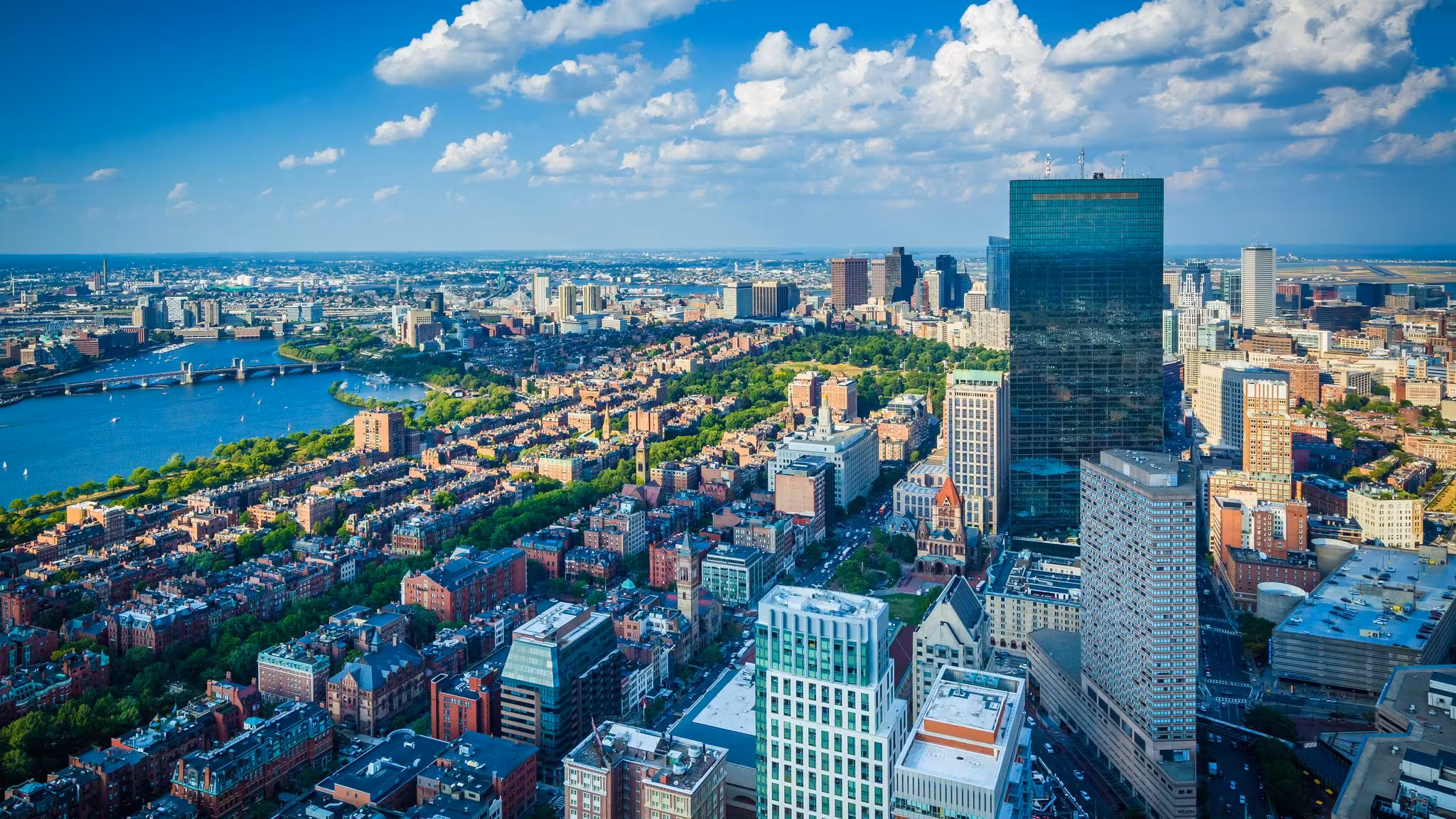 Aerial view over Boston's Back Bay brownstones toward the Charles River
