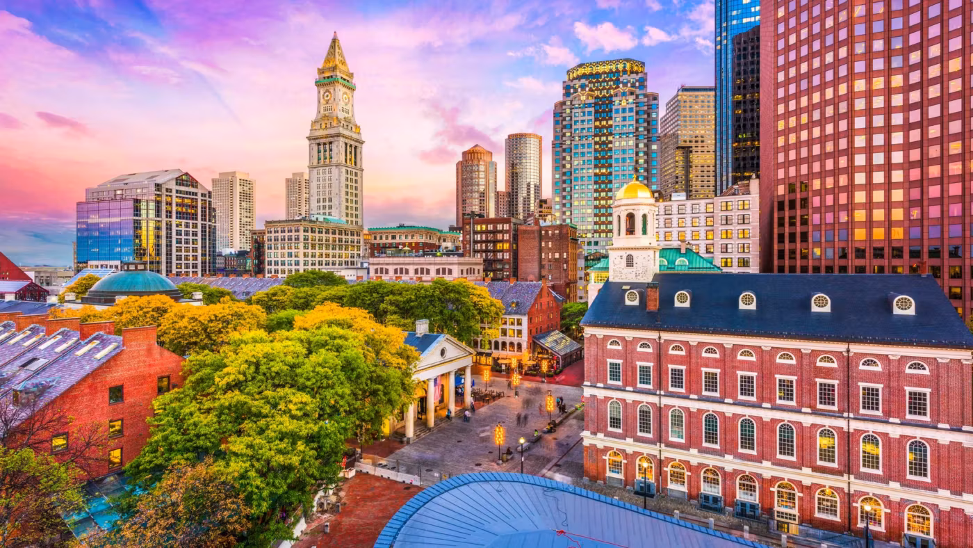 Faneuil Hall and the Custom House tower in Boston at dusk