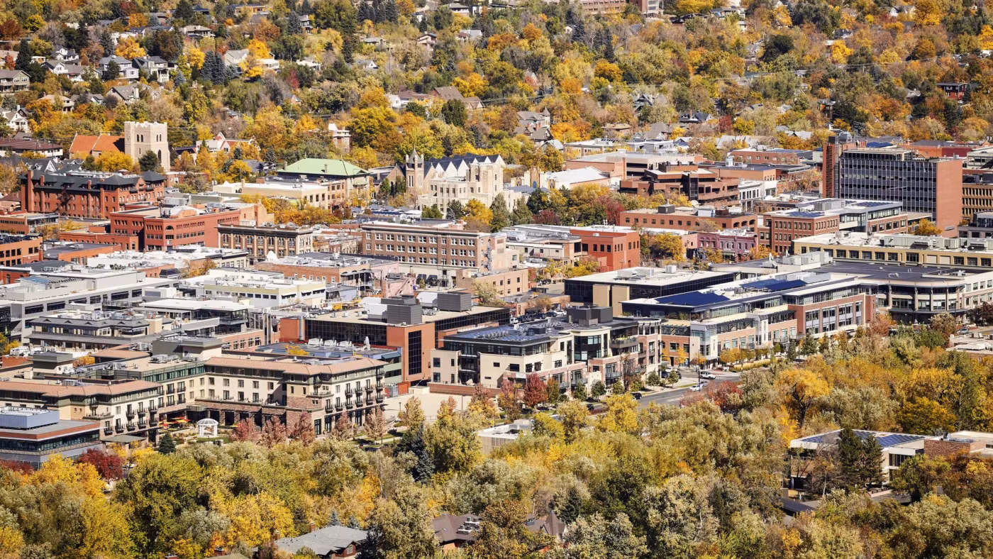 A Colorado town from above with its trees turning in autumn