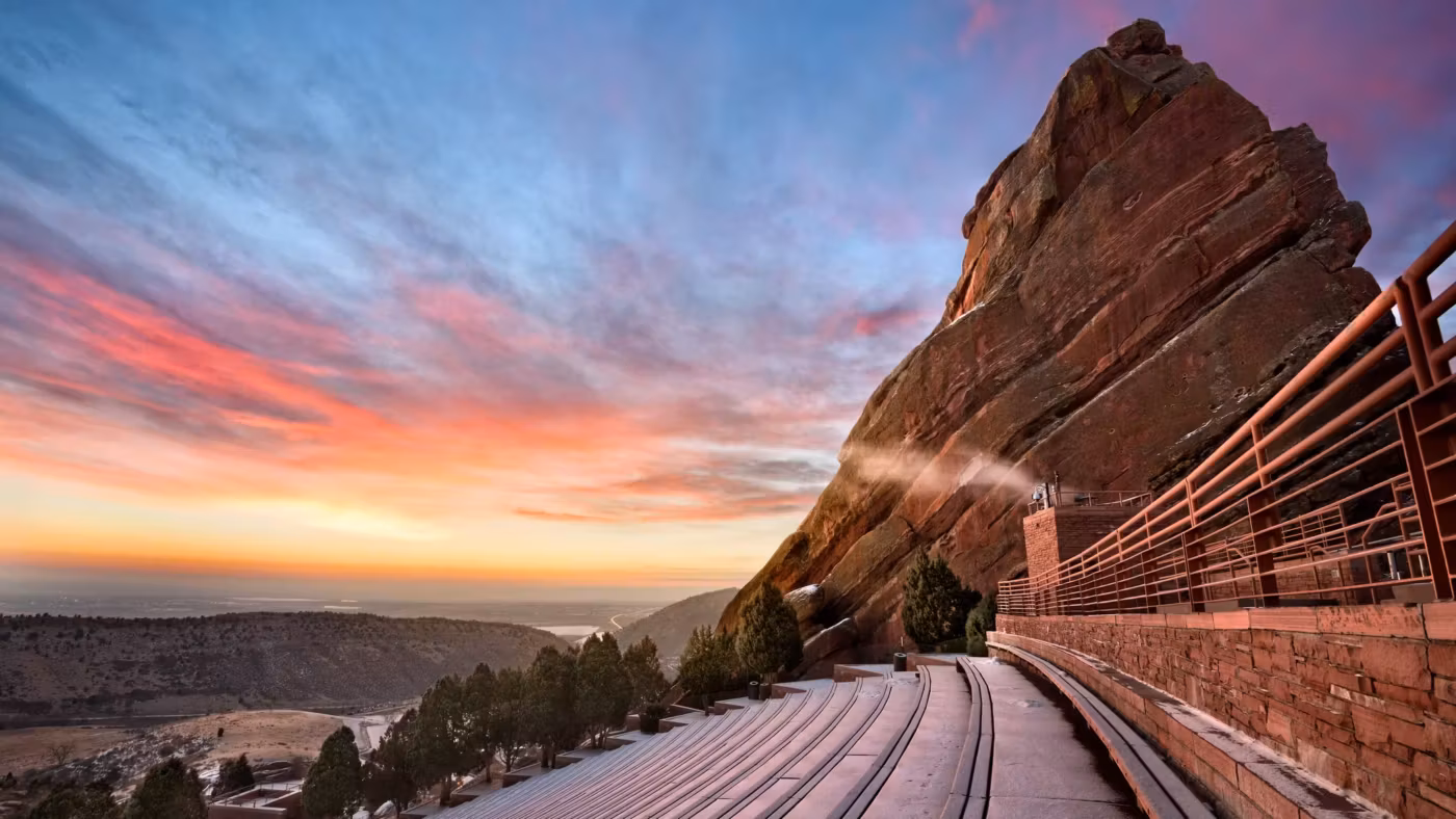 The rock face and stepped seating of the Red Rocks amphitheatre near Denver at sunrise