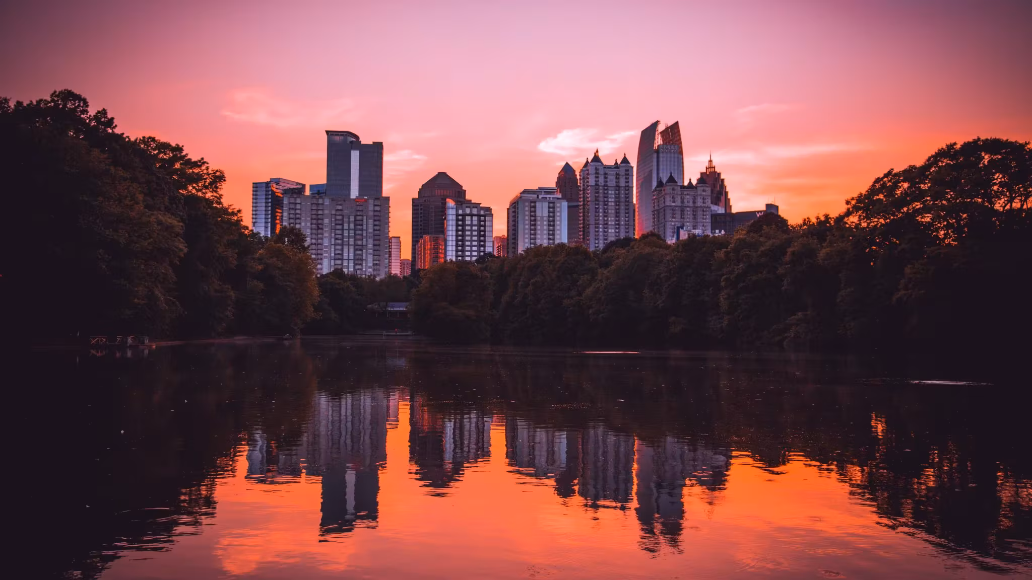 The Atlanta skyline at sunset, reflected in the lake at Piedmont Park