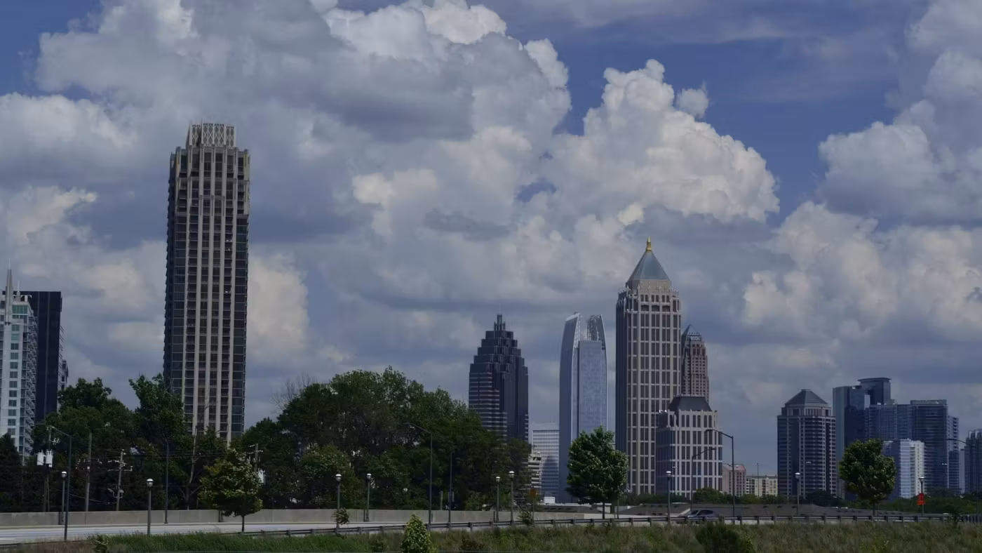 Midtown Atlanta's towers under tall summer clouds