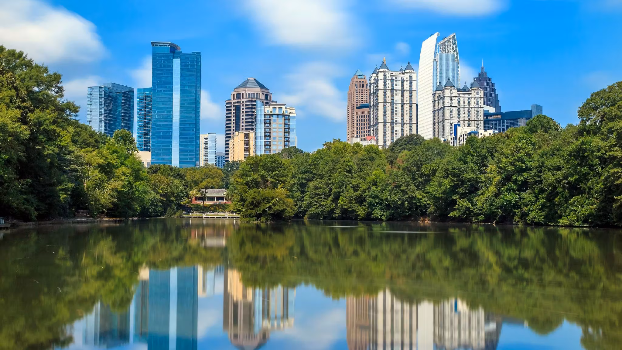 Midtown Atlanta reflected in the still lake at Piedmont Park