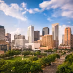 Downtown Houston seen over a park on a bright day
