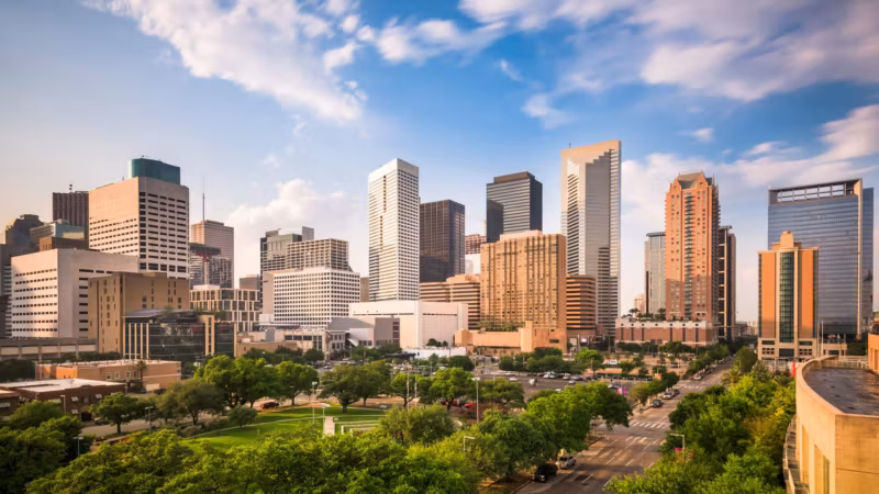 Downtown Houston seen over a park on a bright day