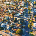 Aerial view of tightly packed Los Angeles houses and streets at golden hour
