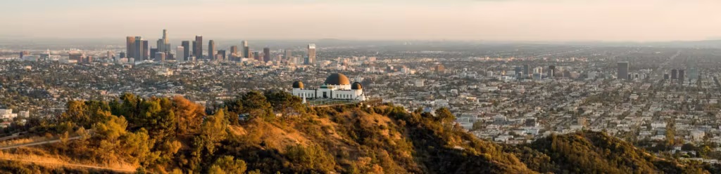 The Griffith Observatory on its ridge with the Los Angeles skyline behind it