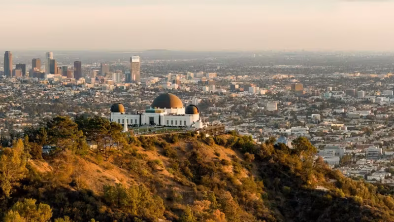 The Griffith Observatory on its ridge with the Los Angeles skyline behind it