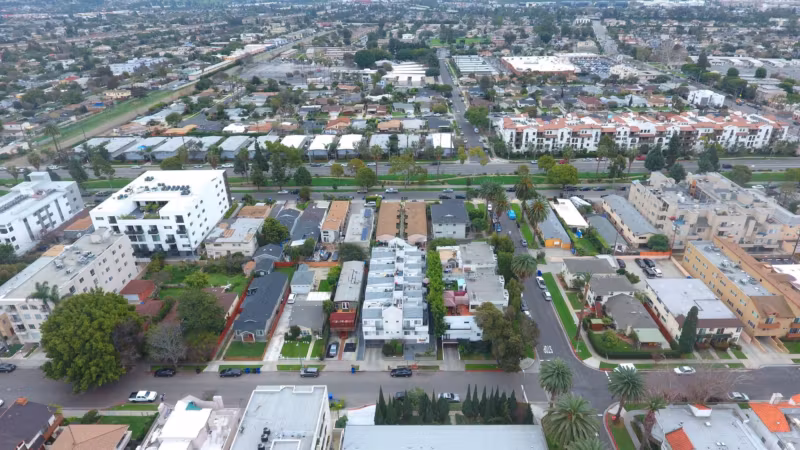 Aerial view of low-rise Los Angeles blocks, streets and parked cars
