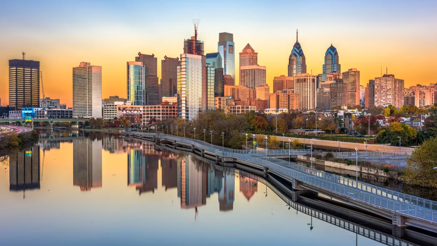 The Philadelphia skyline reflected in the river at sunrise