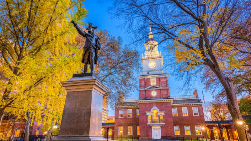Independence Hall in Philadelphia framed by autumn trees