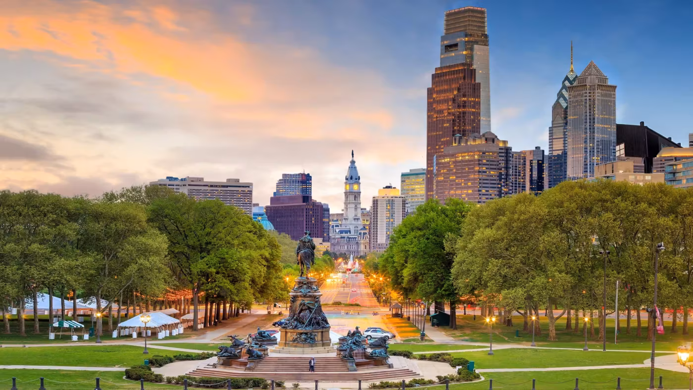 The Benjamin Franklin Parkway at sunrise with City Hall and the skyline beyond