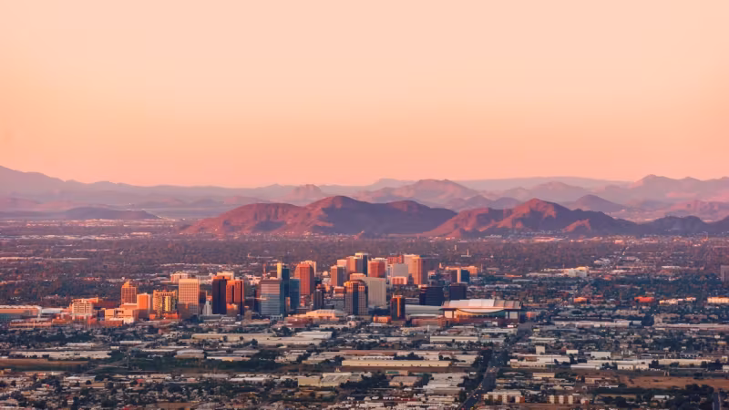 The Phoenix valley at dawn, the city spread below distant mountains
