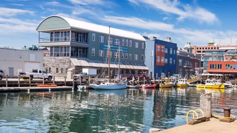 Boats moored beside waterfront buildings in Portland