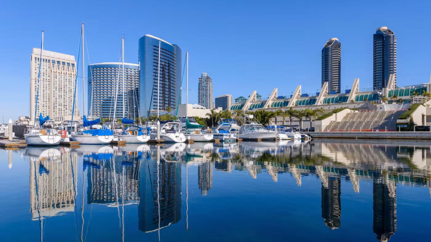 San Diego's marina and waterfront buildings reflected in still water