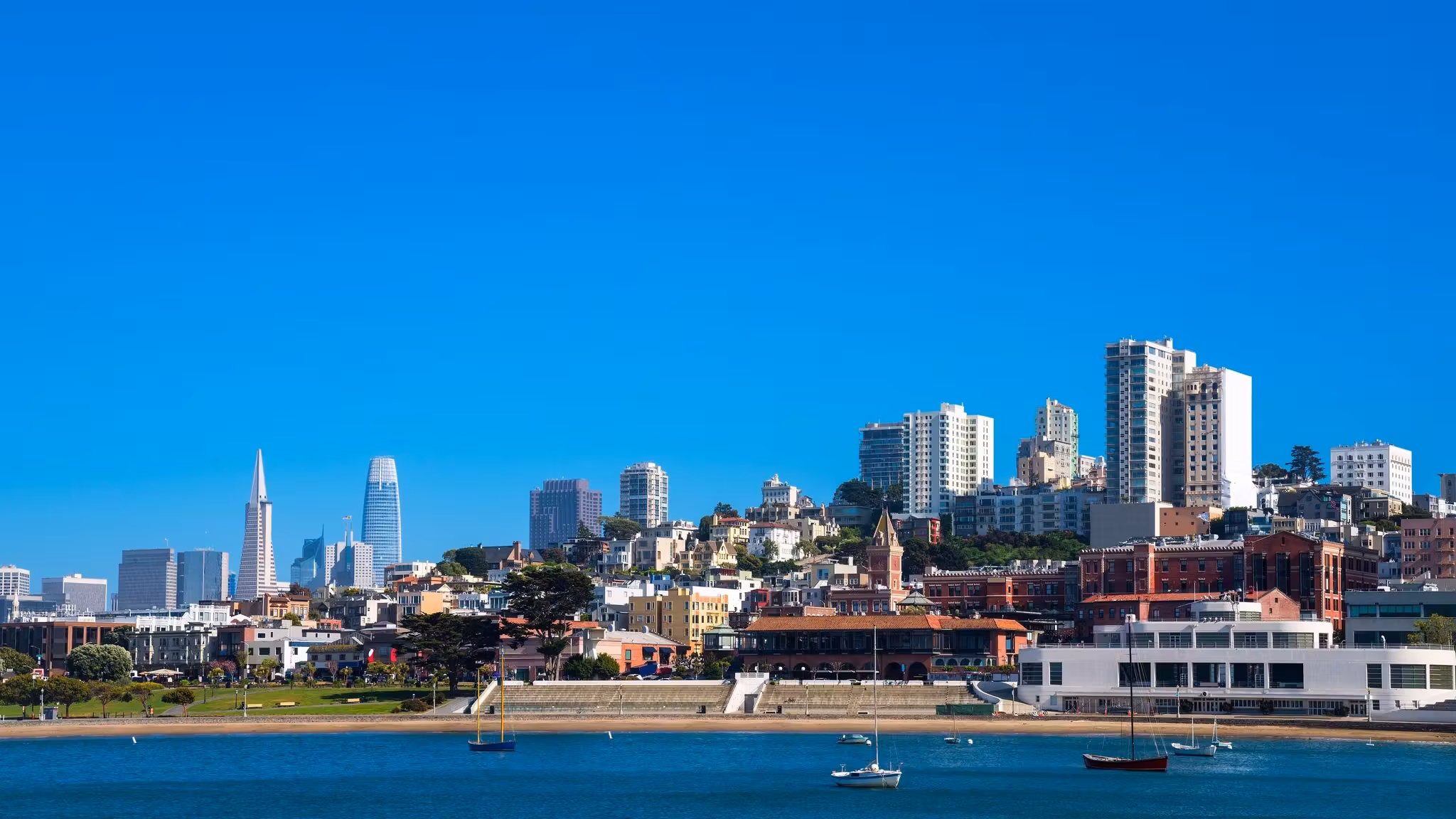 San Francisco's hillside blocks seen from the bay with the downtown towers behind