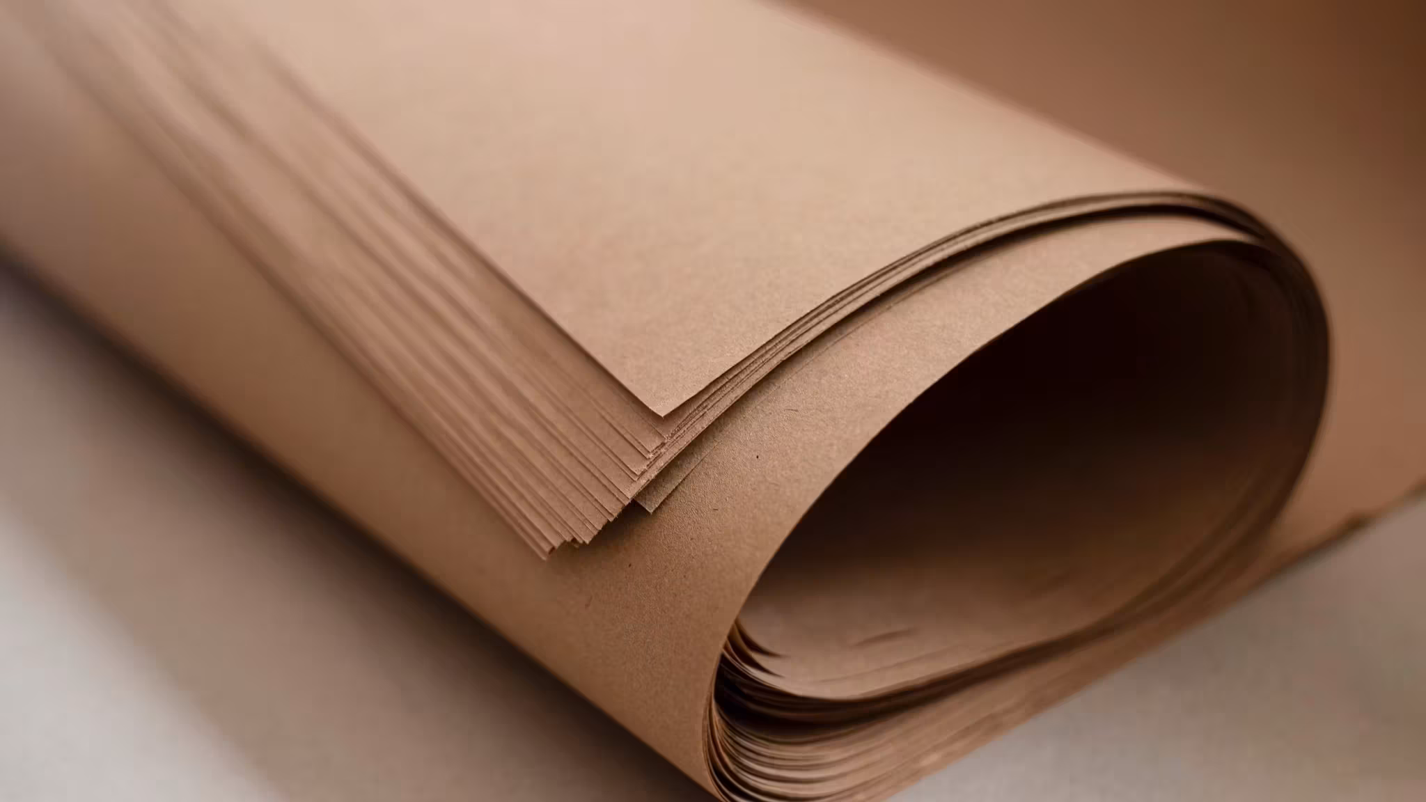 A part-unrolled roll of kraft packing paper