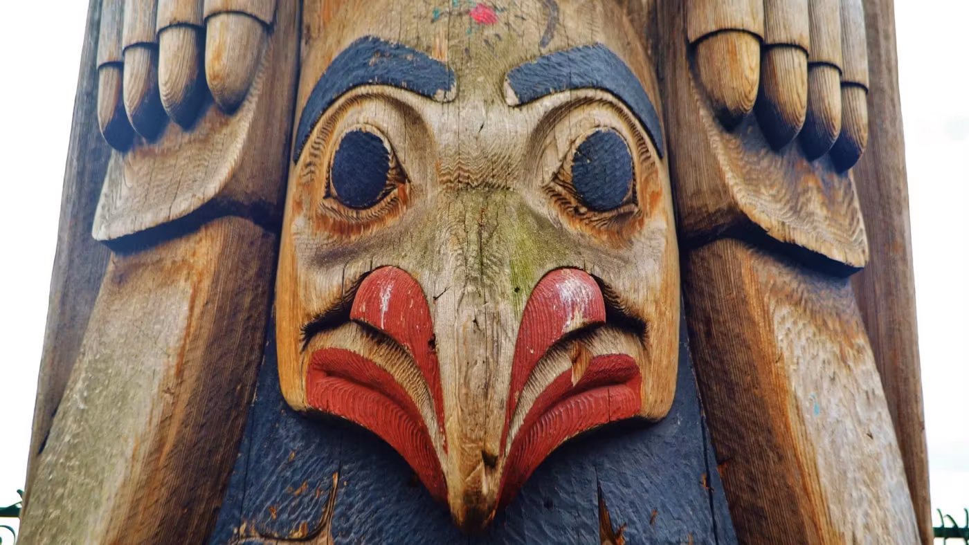 The carved face at the top of a totem pole in Seattle