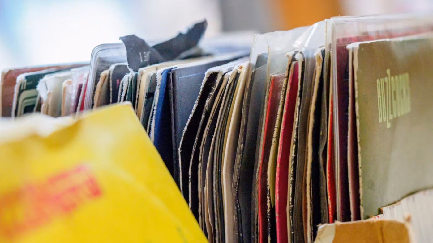 A row of hanging files in a drawer, each one tabbed
